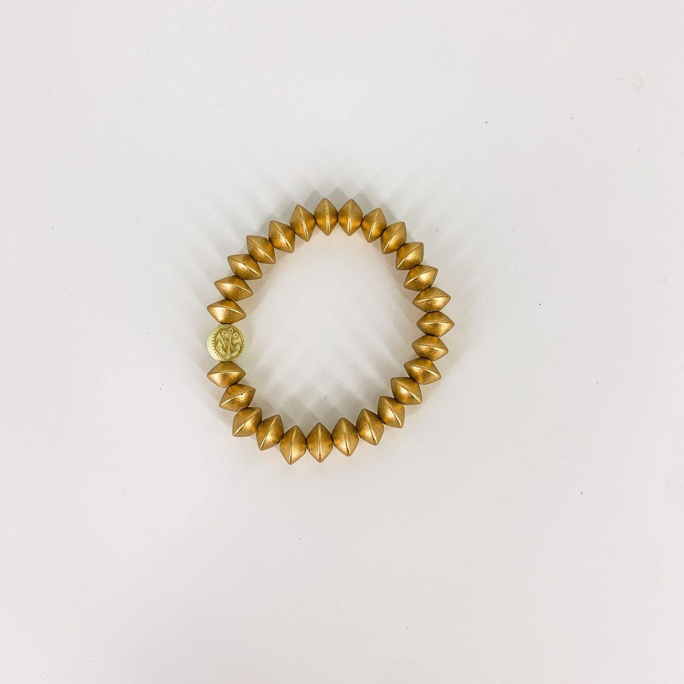 Gold conical beaded bracelet with an Anchor beads trademark bead