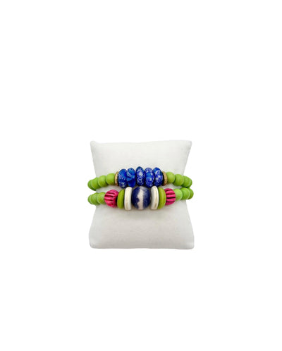 round green, flat gold, round textured hot pink, flat white, and round blue bead stretch bracelet