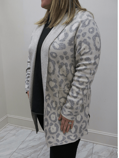 Jacquard cardigan front view on plus size 16.
