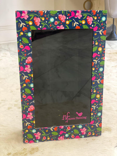 Navy and floral patterned 12 sectioned box with plexiglass window for storing Nora Fleming minis