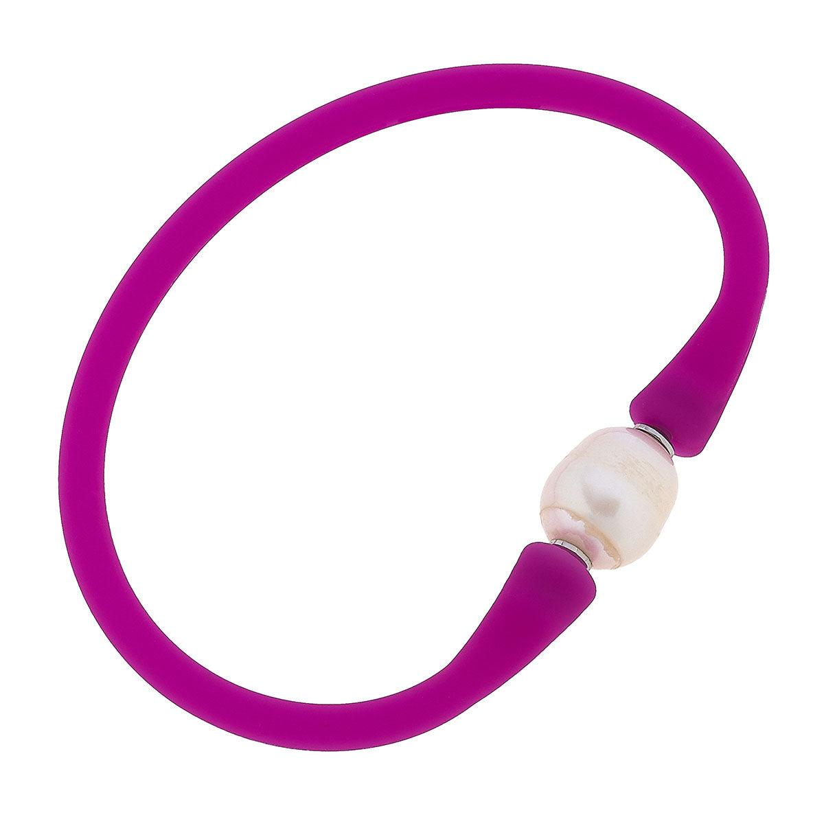 Magenta silicone bracelet with a small pearl bead
