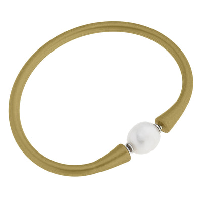 Shiny gold silicone bracelet with a small pearl bead
