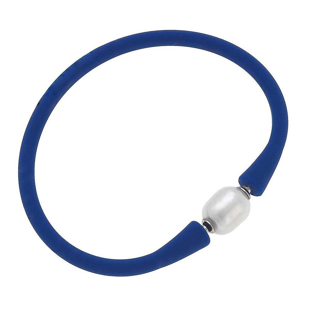 Dark blue silicone bracelet with a small pearl bead