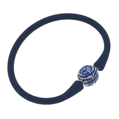 Navy silicone bracelet with a small chinoiserie bead