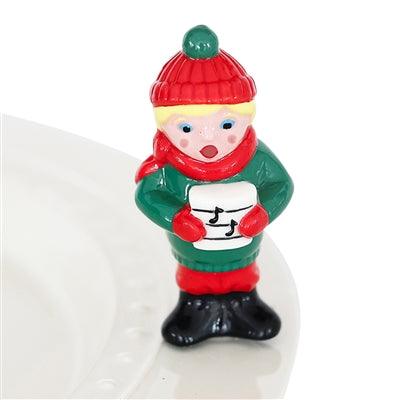 Caroler figurine with a hat and scarf on
