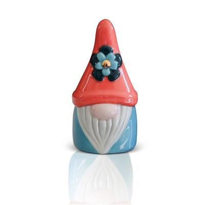 Glass gnome with red hat and black and blue flower