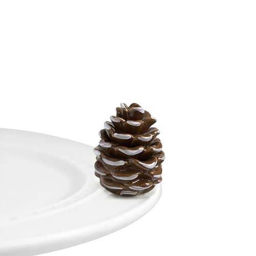 Pinecone with snow on the edges