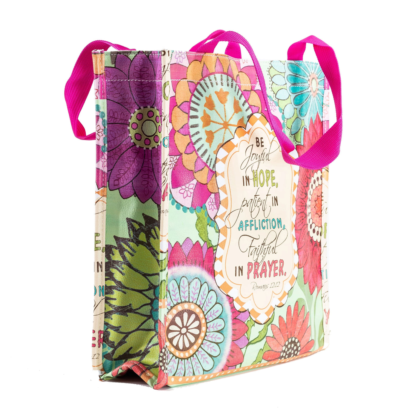 Colorful tote bag with pink straps and Romans 12:12 printed on the front